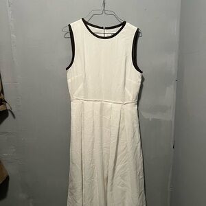 Elegant White Sleeveless Dress with a Green Trim